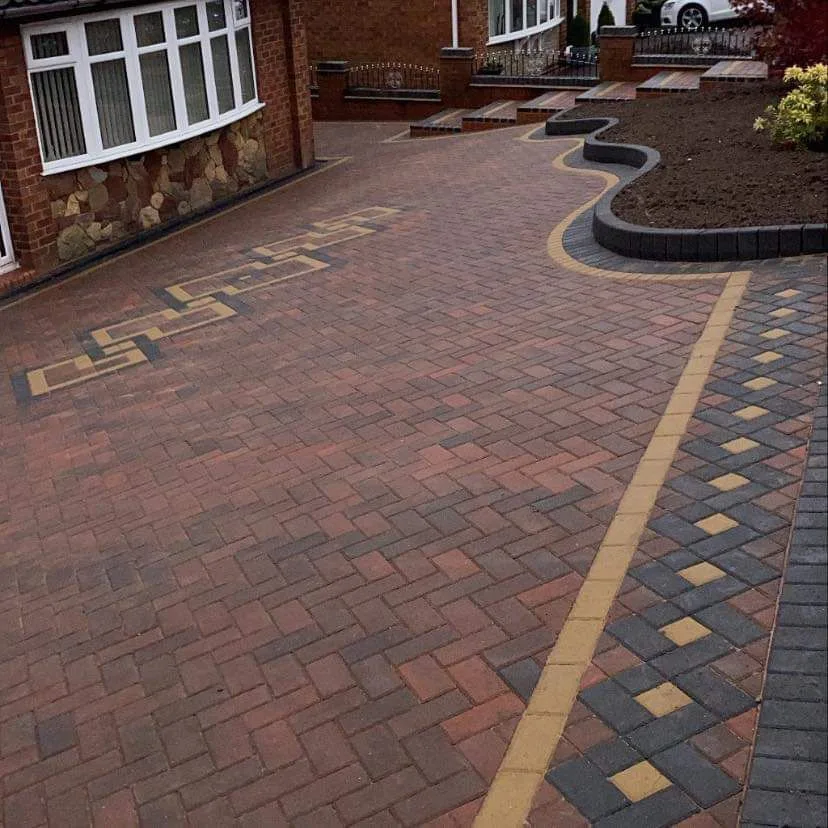 Intricate block paving driveway with decorative feature inlay installed by A.L. Landscapes in Manchester