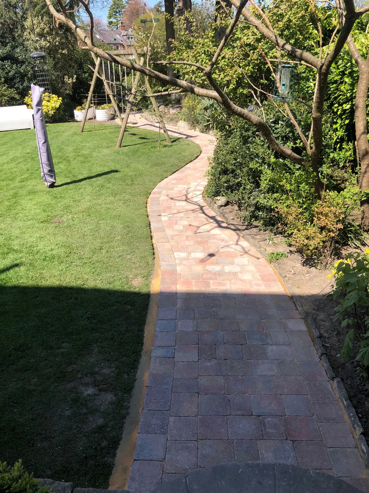 Curved block paving garden path in Manchester