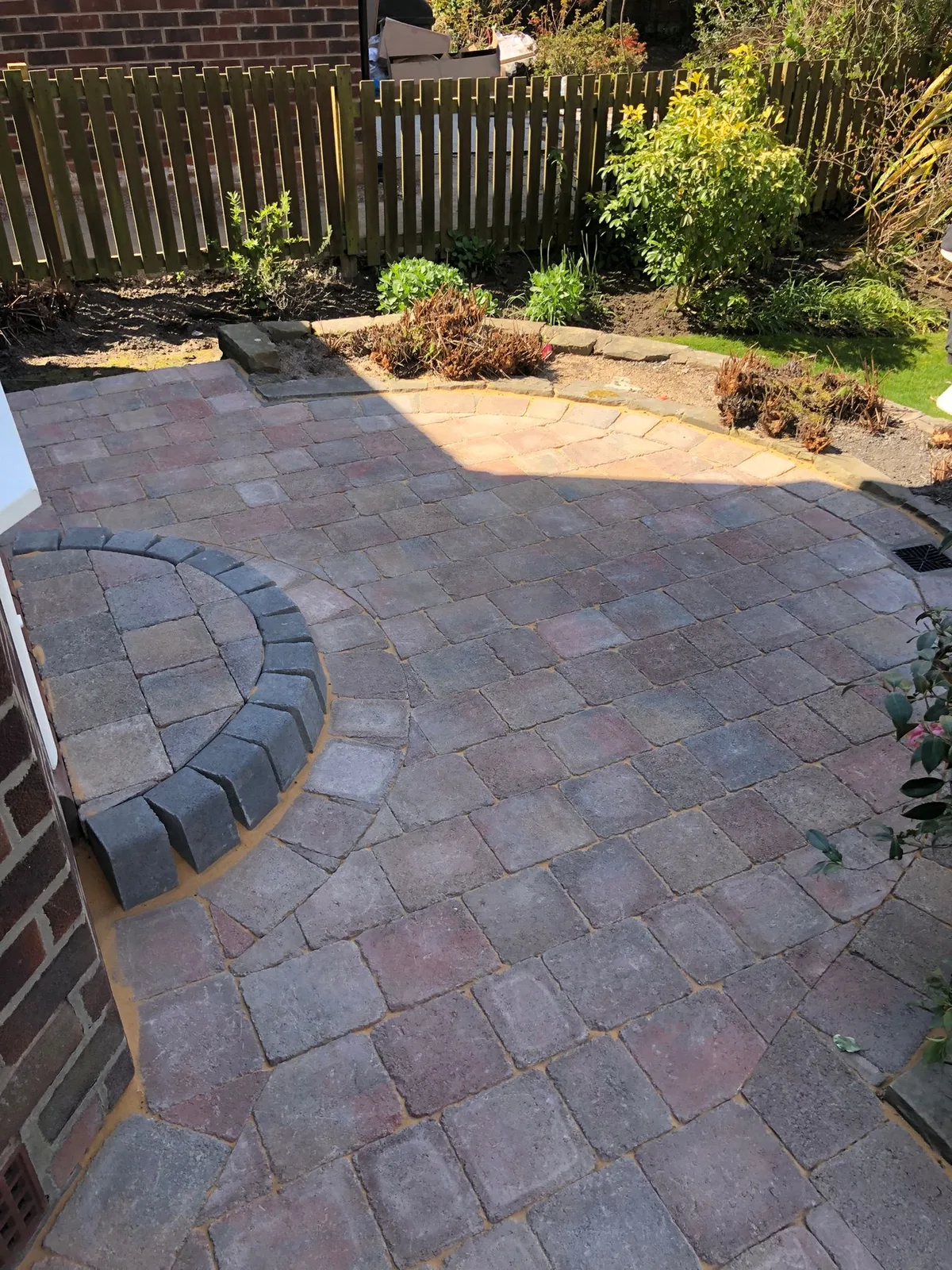 Block paving patio with circular step feature - Manchester