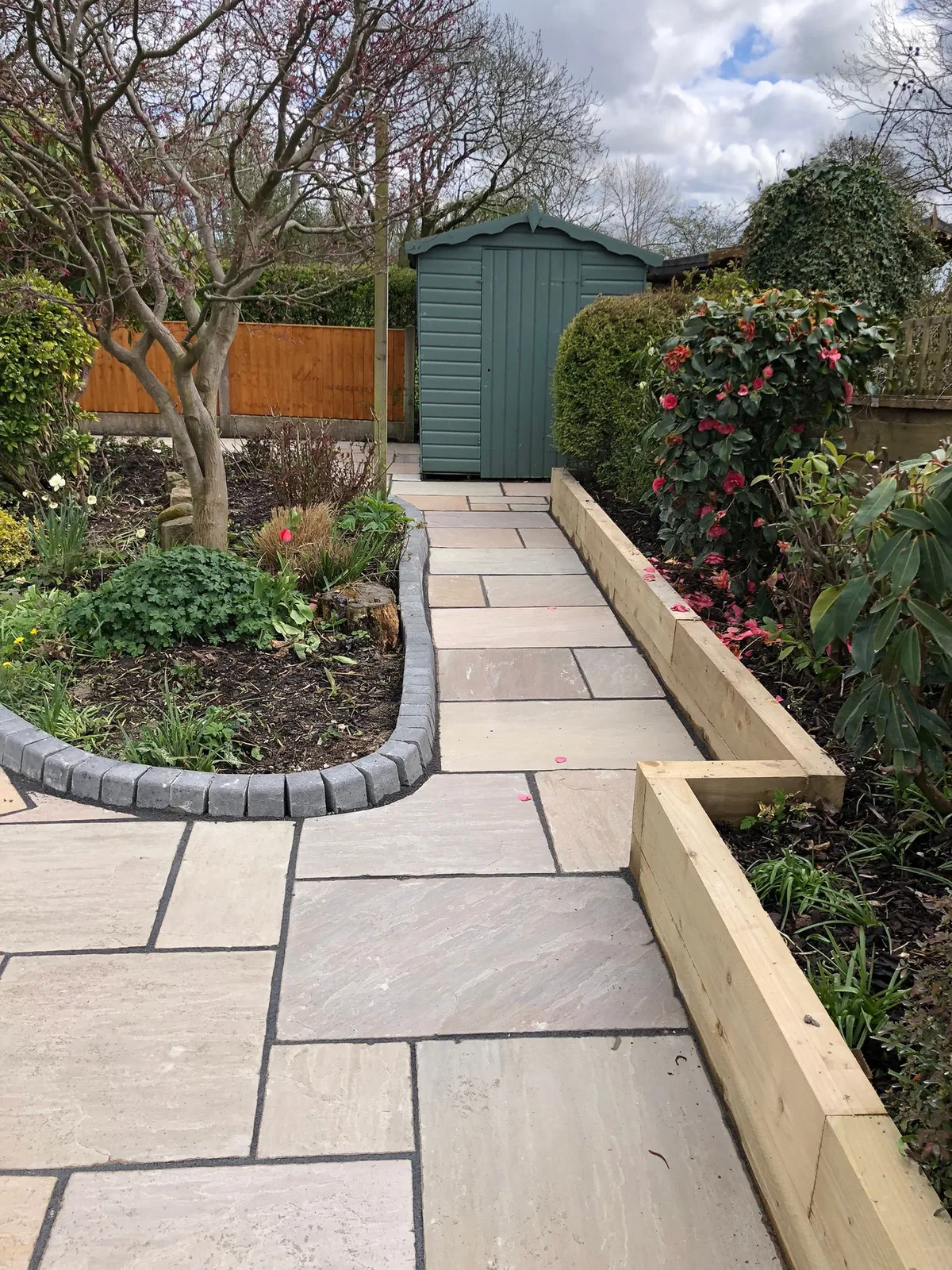 Indian sandstone path with raised garden beds - Manchester