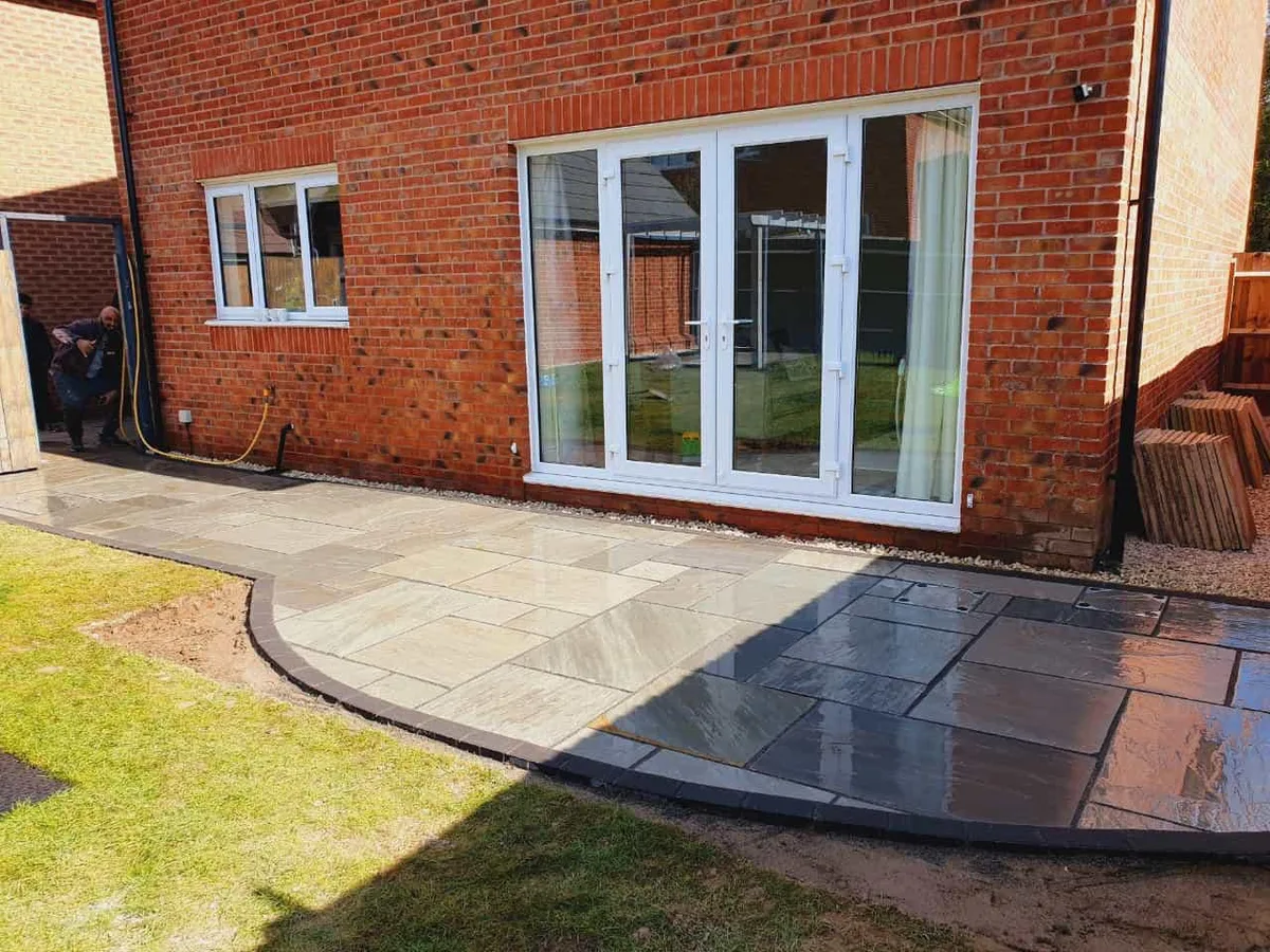 Indian sandstone patio with bifold doors in Manchester