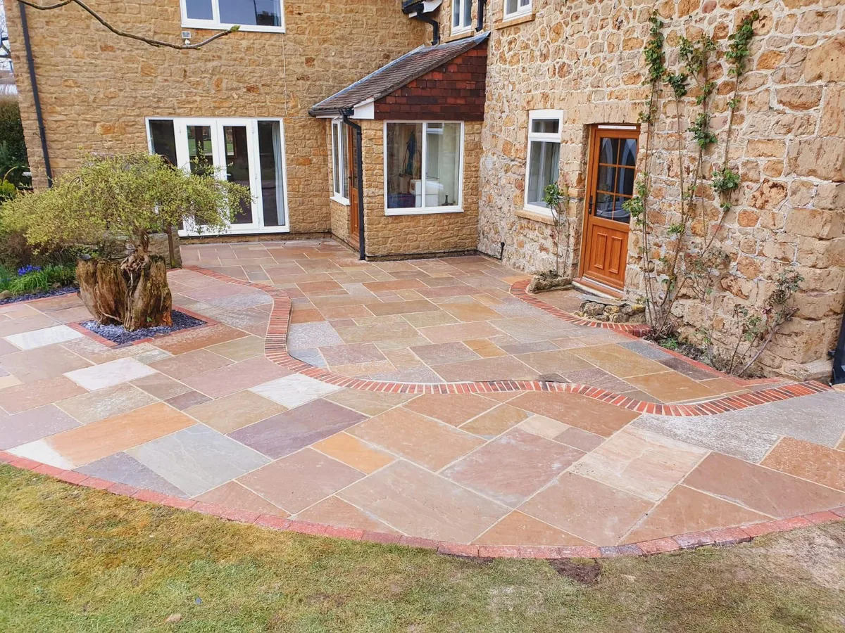 Indian sandstone patio on stone cottage in Manchester
