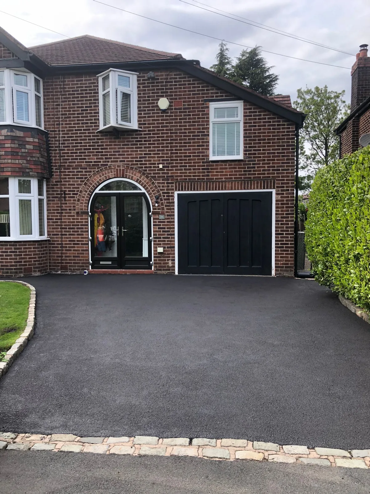 Completed tarmac driveway on a semi-detached house in Manchester by A.L. Landscapes